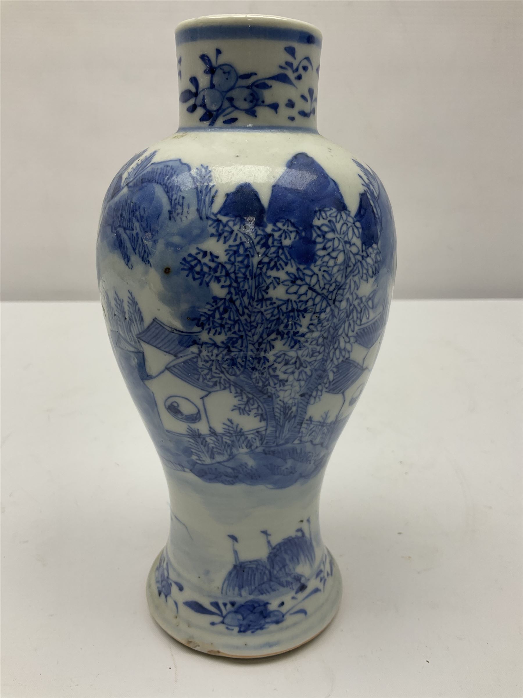 19th century Chinese Kangxi style blue and white jar and cover, decorated with figural and landscape scenes, the domed cover with foo dog finial, with four character marks beneath, H22cm