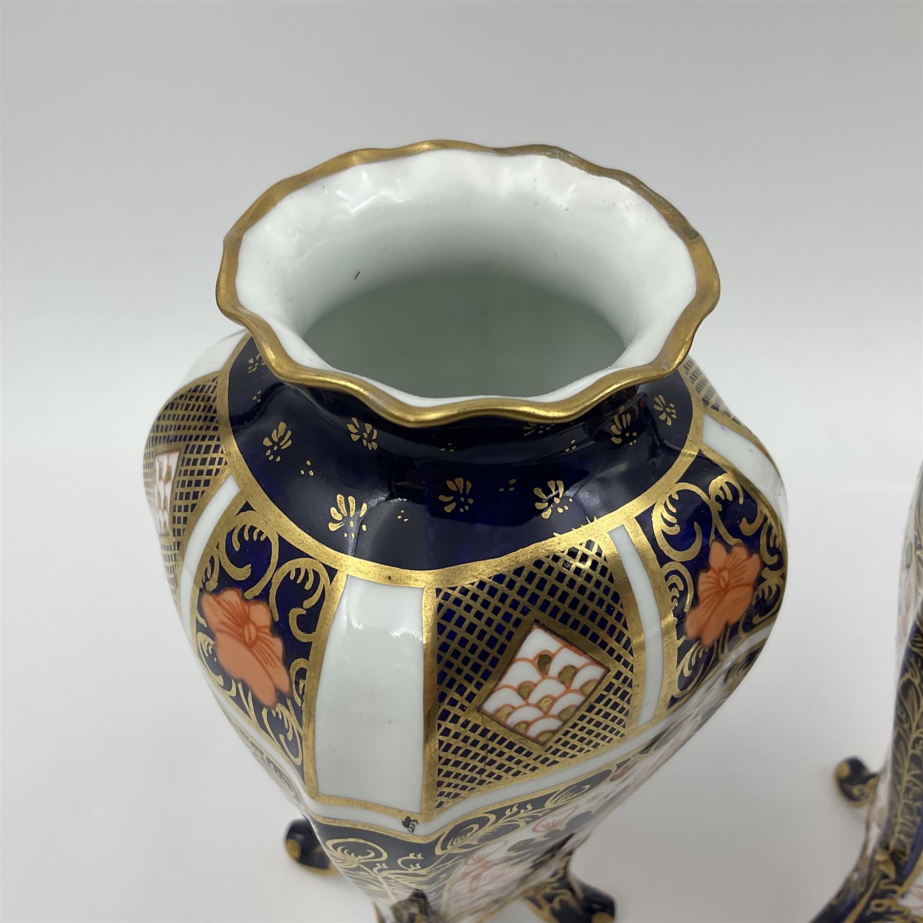 Pair of early 20th century Royal Crown Derby Imari 1128 pattern vases, of tapering straight sided form with waisted neck and frilled rim, upon four splayed feet, with printed and painted marks beneath including illustration date codes for 1911 and 1920, H17cm