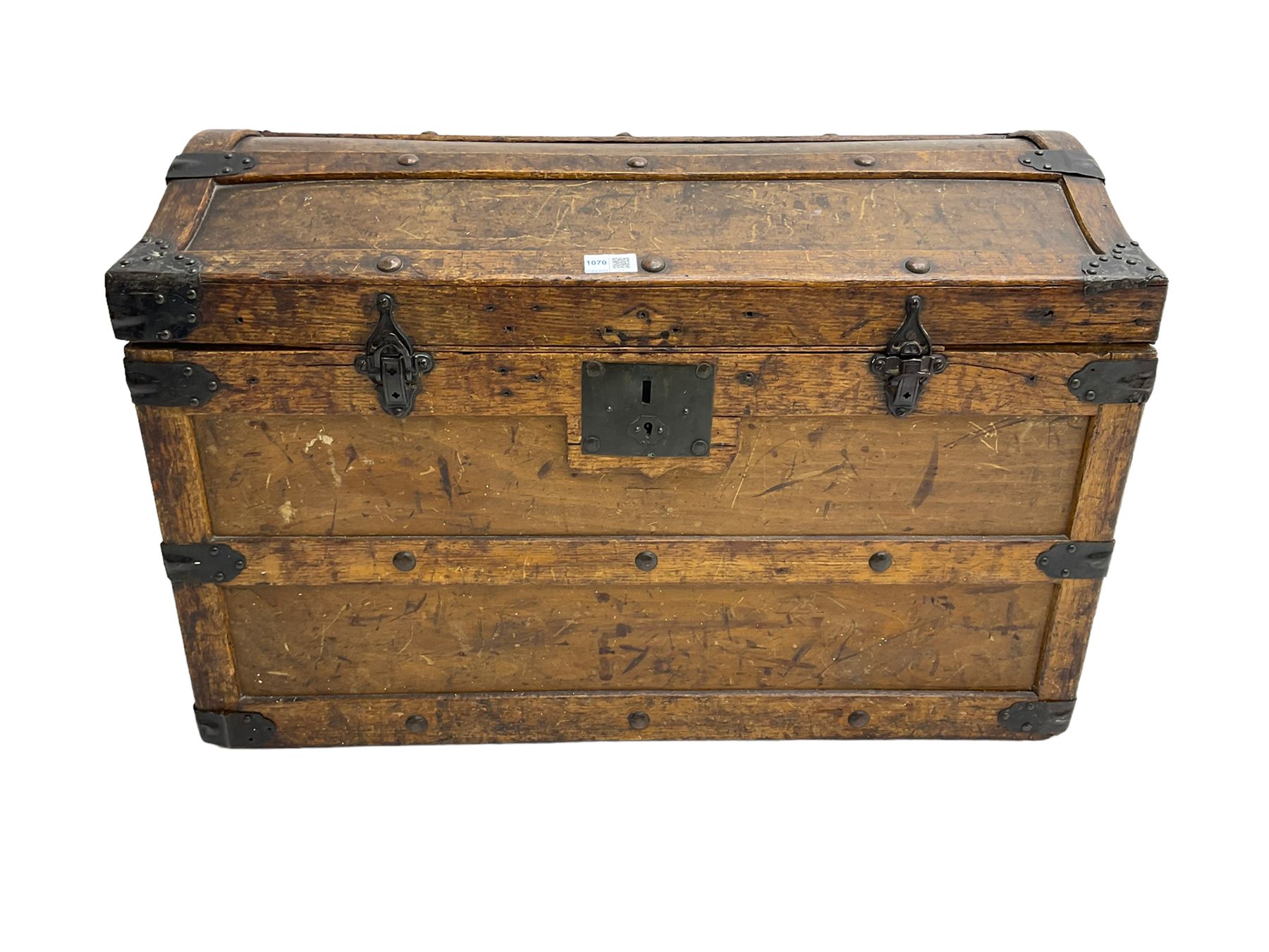 Late 19th to early 20th century oak framed travelling trunk, dome top with iron fittings and panelled sides and top, interior labelled 'The Anchor Patent Waterproof Travelling Trunk - 1902'