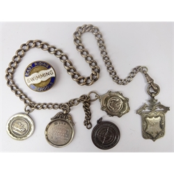  Cycling - a Victorian Yorkshire Road Cycling Club silver fob, Geo. Vl silver medal inscribed Old Malton St.Mary's FC Junior League S.Wood, and two silver and Sterling swimming medals on watch chain, Birmingham 1891-1931, RLSA medal inscribed T S.Wood 56610 & an East Riding Schools Swimming enamel lapel badge (7)  