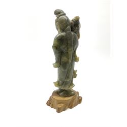 A Chinese carved jade figure modelled as Guanyin, including base H23.5cm. 
