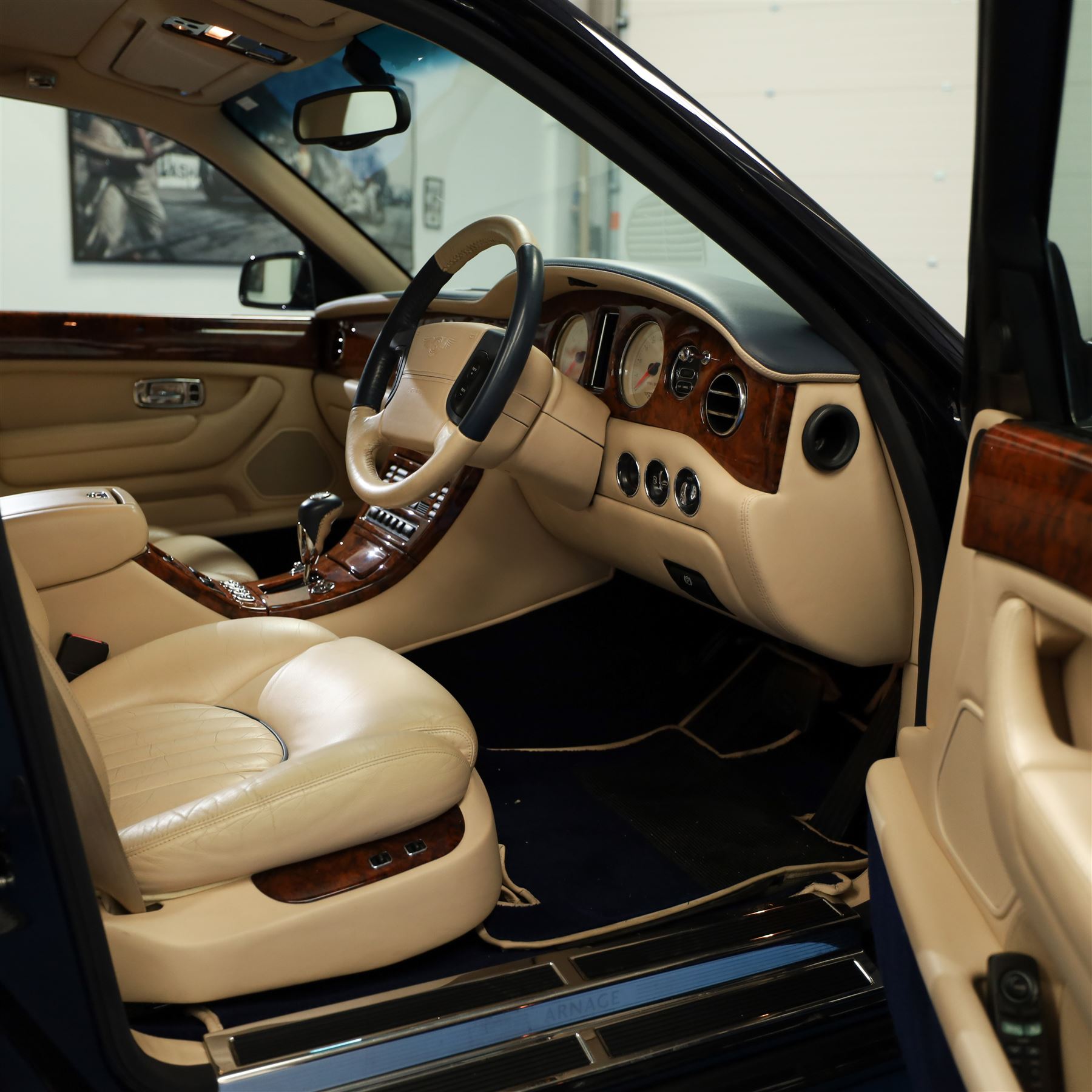 2001 Bentley Arnage Red Label Saloon

Registration: BU51 TGX
Engine: 6.75-litre turbocharged V8 petrol
Transmission: Automatic
Odometer reading: 39,942 miles
Colour: Black Sapphire metallic
Interior: Magnolia leather with burr walnut veneers
Previous owners: 3
V5C: Present
Service history: Good service records

An exceptional Bentley Arnage Red Label Saloon, finished in Black Sapphire metallic, a very dark blue, with a Magnolia leather interior, contrasting dark blue carpets and extensive burr walnut veneers. The car displays an odometer reading of approximately 39,942 miles.

The Arnage Red Label combined Bentley’s renowned 6.75-litre turbocharged V8 engine with automatic transmission, delivering effortless performance in a traditionally appointed luxury saloon. The model is distinguished by its imposing proportions, characteristic Bentley radiator grille and finely crafted interior.

Presented in excellent condition throughout, the bodywork and metallic paint finish appear particularly well preserved, complemented by clean brightwork and the correct Bentley alloy wheels. The engine bay is also notably well detailed.

The interior presents exceptionally well, retaining its Magnolia leather upholstery, polished burr walnut veneers, original factory instrumentation and switchgear. The leather displays only light creasing consistent with careful use.

The car has had three previous owners and is accompanied by good service records.

Features

• 6.75-litre turbocharged V8 petrol engine
• Automatic transmission
• Black Sapphire metallic paintwork
• Magnolia leather interior
• Contrasting dark blue carpets
• Burr walnut veneers
• Electrically adjustable front seats
• Air conditioning
• Factory instrumentation and switchgear
• Bentley alloy wheels
• Right-hand drive
• Odometer reading of approximately 39,942 miles
• Three previous owners
• Good service records
• V5C present

This vehicle forms part of the Estate of the Late John Sills and is offered for sale by the Executors, confirming a genuine reason for sale.