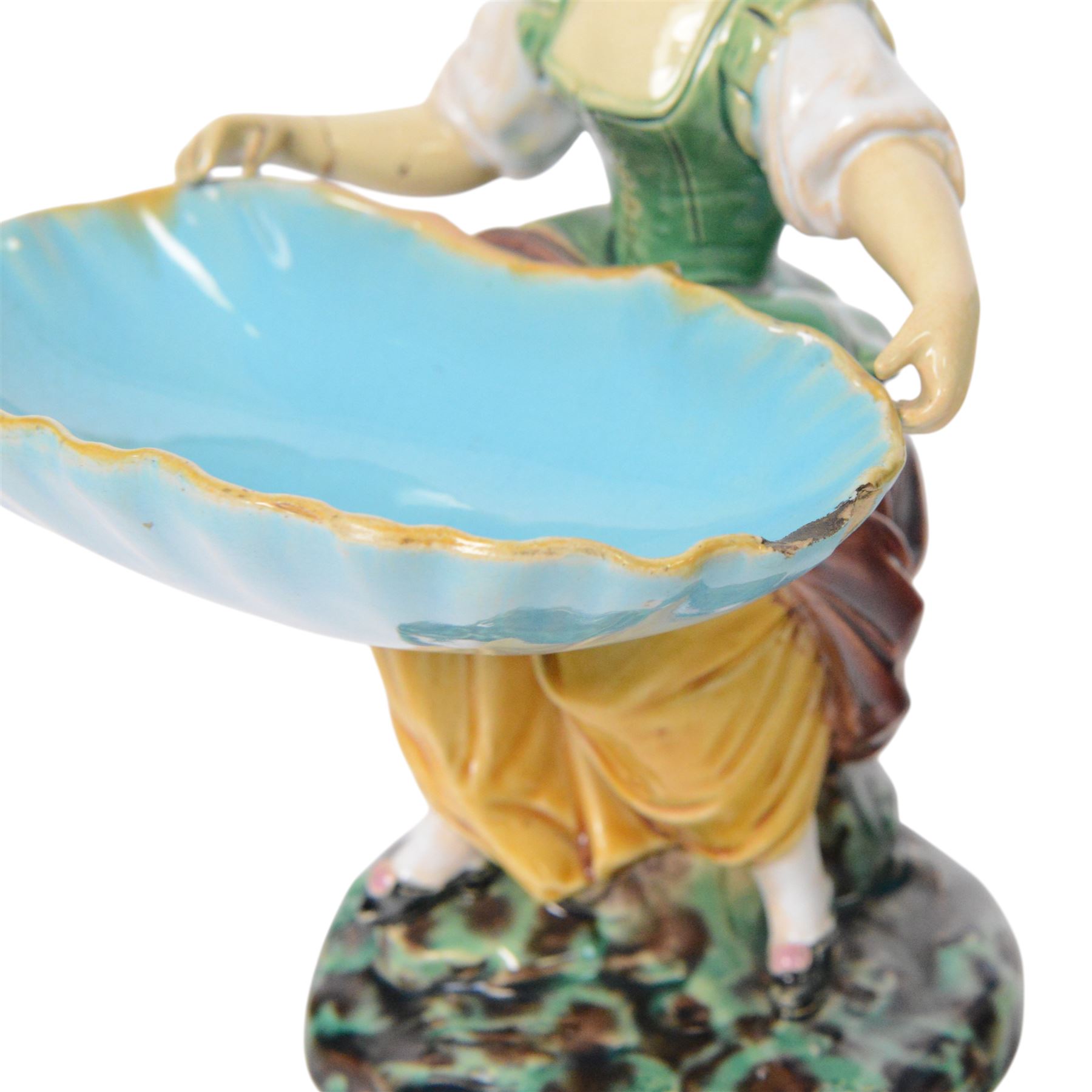 Pair of Minton majolica Hogarth figures, modelled as a seated boy and girl, on tree stumps, both holding sweetmeat dishes, with impressed marks beneath, H18cm 