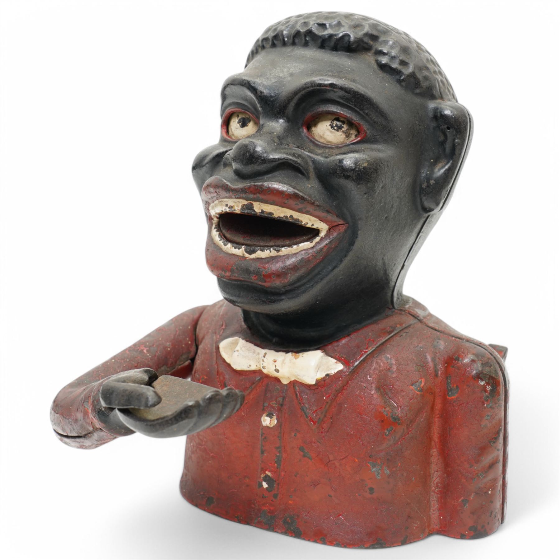 American painted cast iron money bank 'William Tell', the base marked 'Patented June 1896' L26cm and a 'Jolly Nigger' money bank (2)