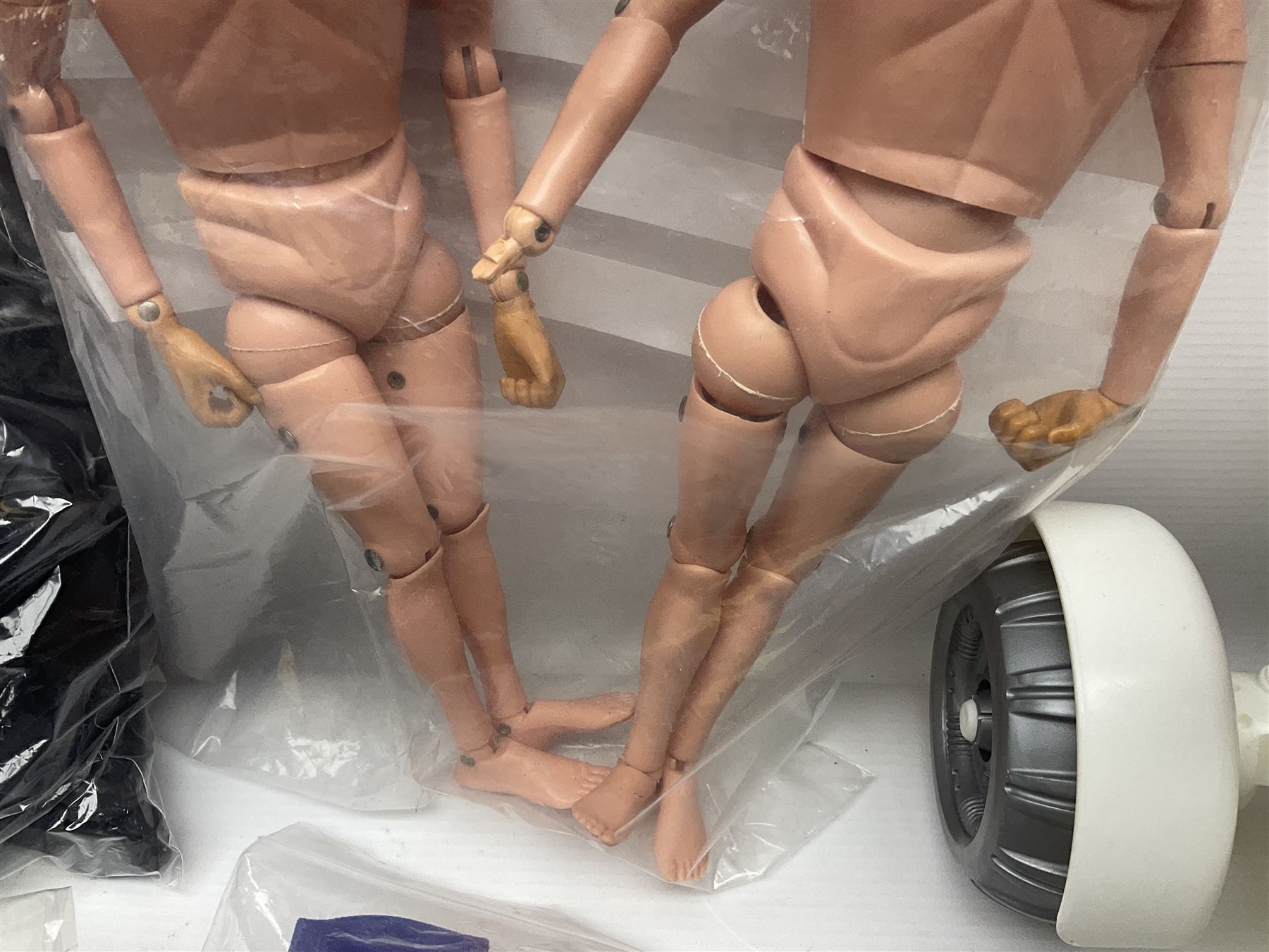 Action Man - large collection of 1960s and later figures and accessories including Spaceman with ATLRV vehicle; two figures marked 'Made in England by Palitoy under licence from Hasbro 1964'; twenty-five assorted weapons; radio backpacks; kit bags; twenty-one pairs of boots; football boots and snow shoes; metal diver's boots and three pairs of flippers; two pairs of jackboots; roller skates; various tunics, trousers, flying suits, jumpers, belts etc; twenty helmets, berets, busby, kepis, submariner etc; and quantity of other accessories