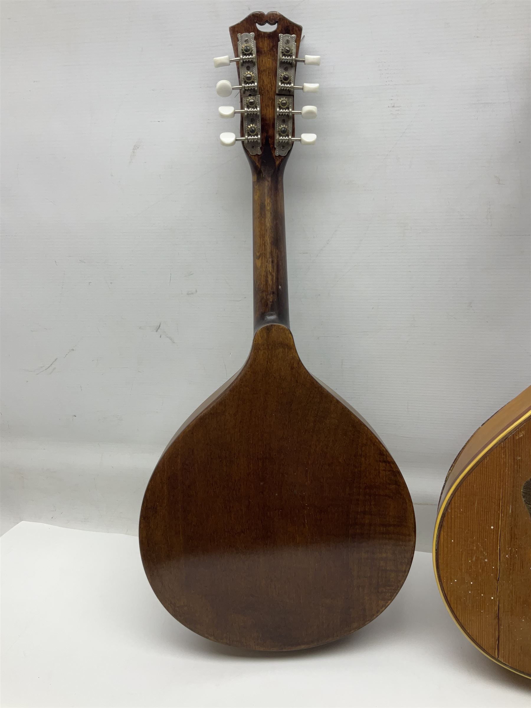 Italian eight-string mandolin with maple back and ribs and spruce top with inlaid floral marquetry panel within a fragmented mother-of-pearl border L61cm; cased; and a (damaged) German 'Michigan' mandolin for spares or repair (2)