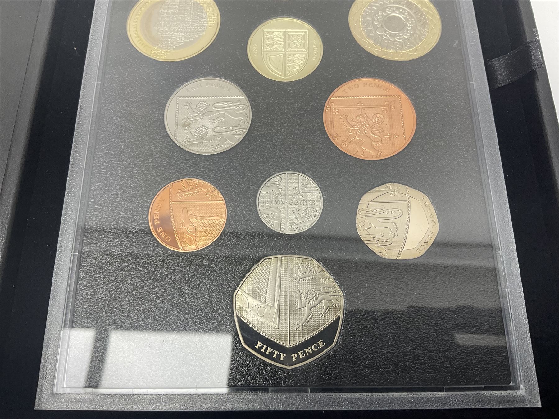 Mostly commemorative coinage, including various Queen Elizabeth II United Kingdom brilliant uncirculated fifty pence, two pound and five pound coins in card folders, The Royal Mint United Kingdom 2012 proof coin set, Alderney 2021 'Royal National Lifeboat Institution' five pound coin cover in Harrington and Byrne folder etc