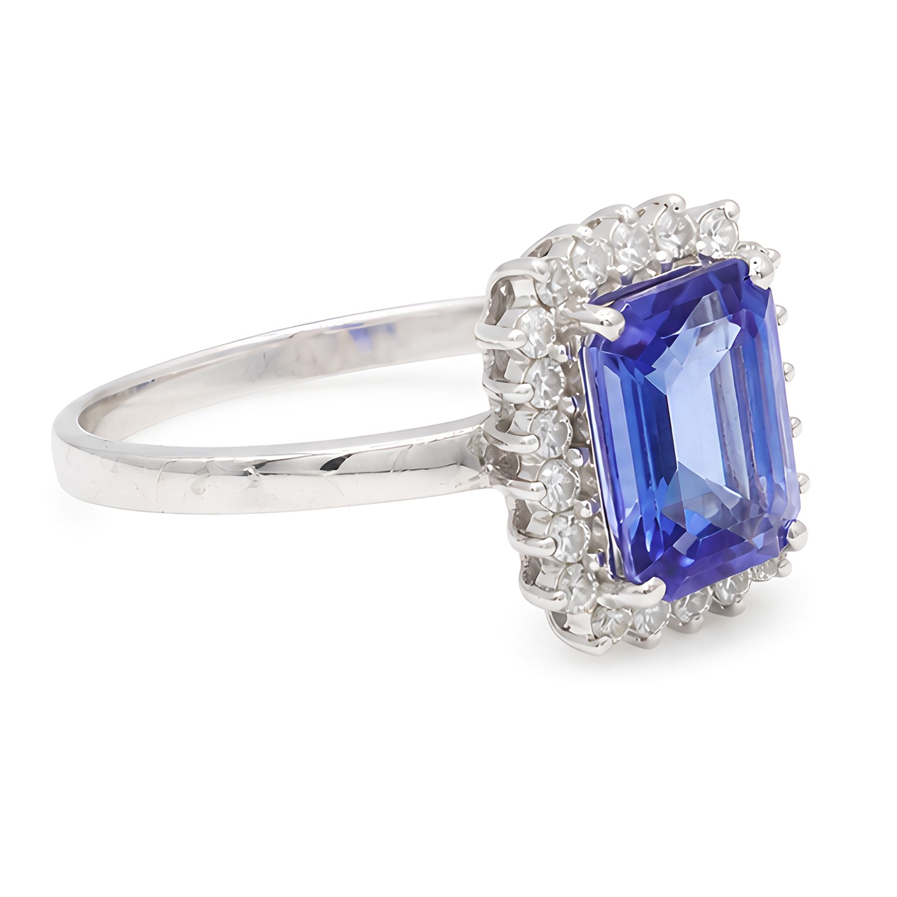 18ct white gold tanzanite and diamond cluster ring, single octagonal cut tanzanite of approx 0.80, surrounded by twenty-two round brilliant cut diamonds, stamped, total diamond weight approx 0.25 carat