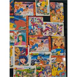 Collection of Pokemon TGC trading cards, including two WB First Movie Black Star promo cards Pikachu no. 4 and Dragonite no. 5, two Ancient Mew Black Star holo promo cards, Gym Challenge Giovanni's Persian 8/132 holo and a small collection WOTC, Neo Discovery and Neo Genesis cards, together with thirty four Bandai Carddass Pokemon cards, including prism Charizard no. 186 and Pokemon Topps cards including holo examples 