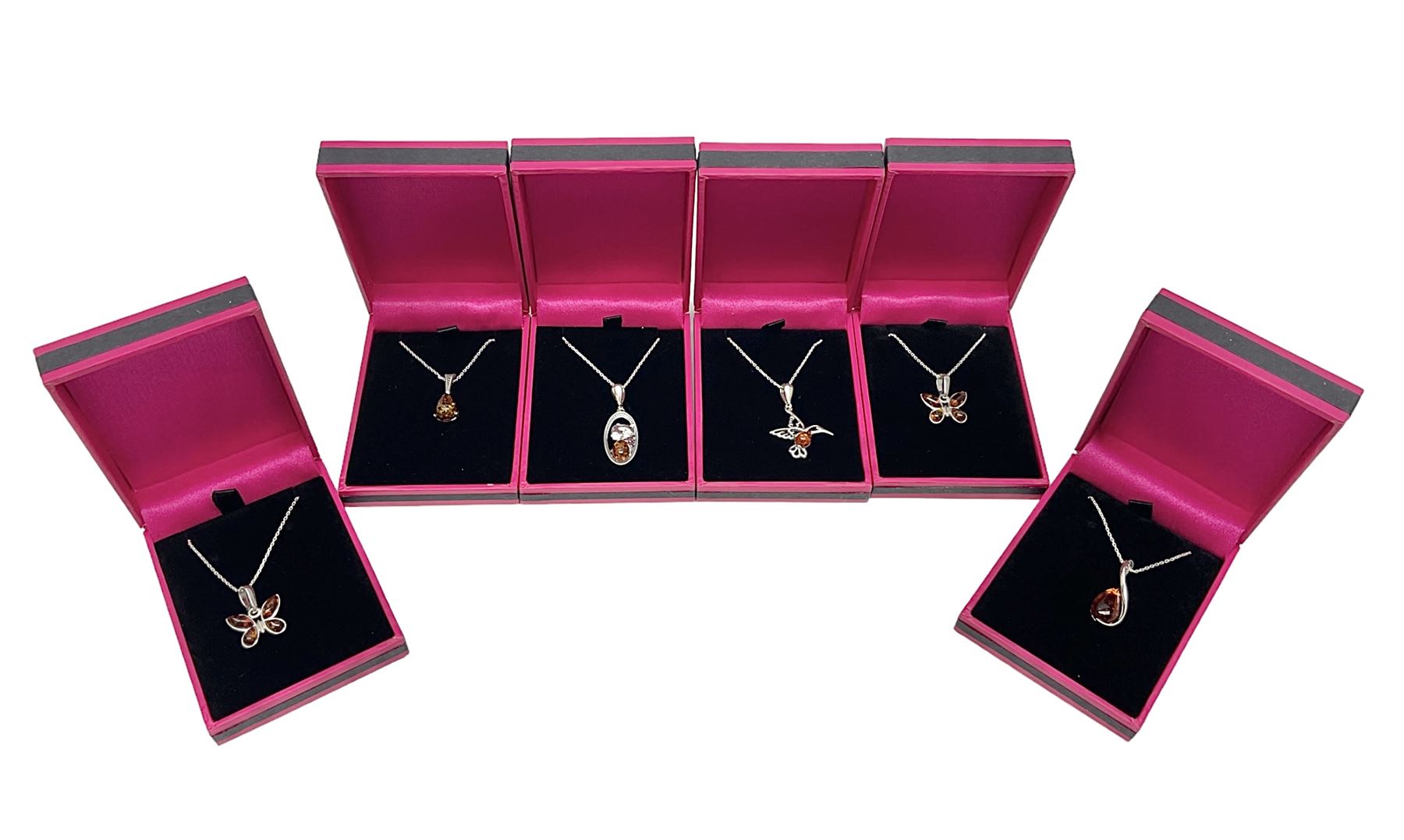 Six silver Baltic amber pendant necklaces, including dinosaur and butterfly designs, all stamped 925 
