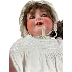 Two German porcelain dolls with moveable limbs