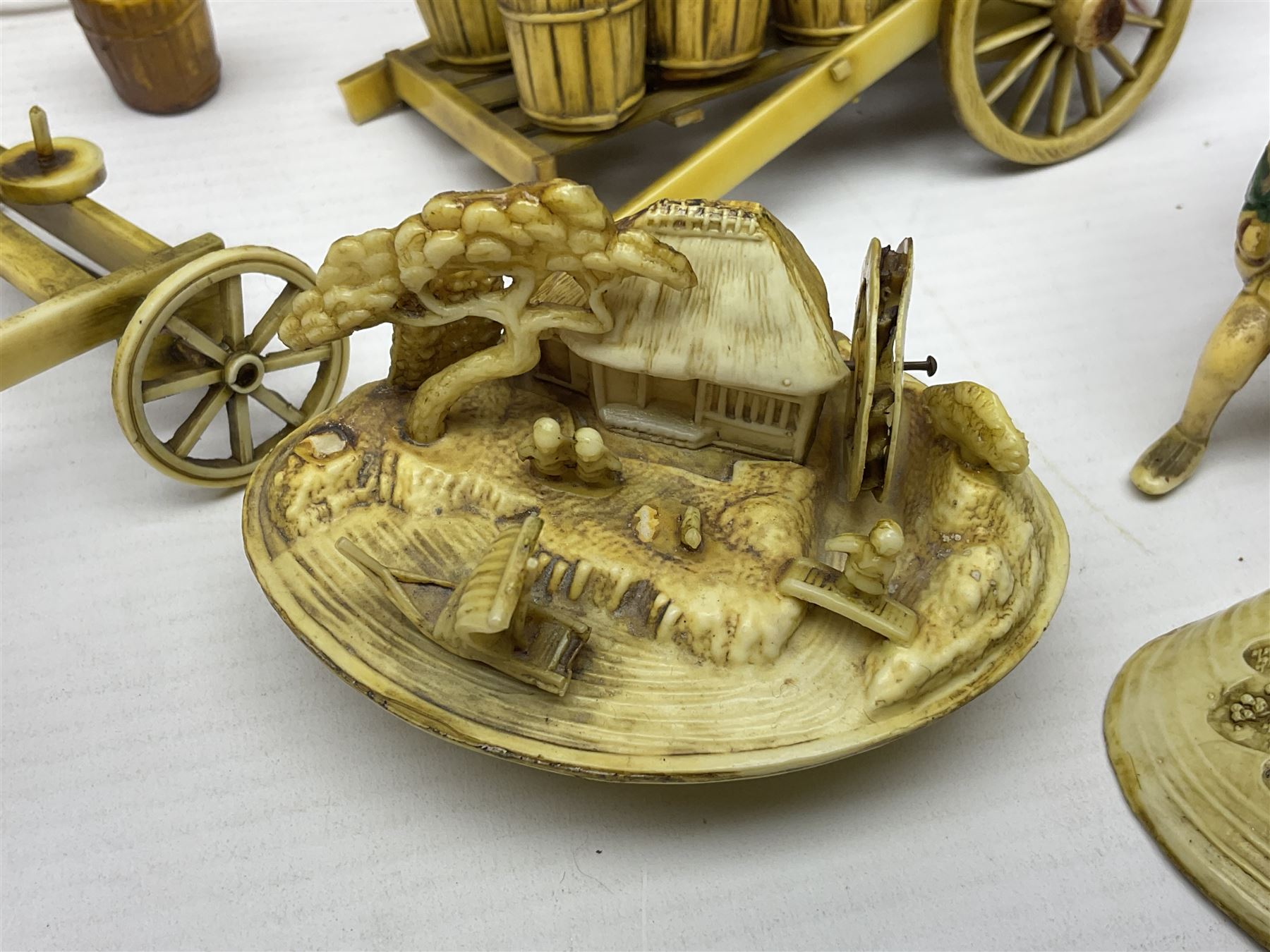 Collection of Japanese celluloid figures, including Rickshaw groups, fishing scene, oxen etc 