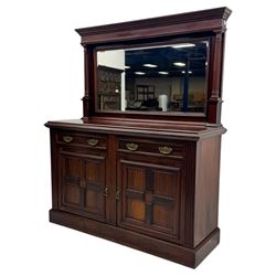 Victorian mirror back press, the arched corniced mirror back flanked by half columns, the base fitted with three drawers and four moulded panel doors with geometric detail, on a block plinth