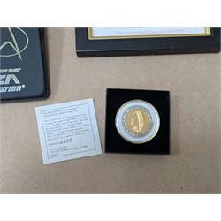 Star Trek collectables, including Danbury Mint '22ct Gold Card Collection', PCS Stamps and Coins Official US Postage Celebrating The Original Star Trek Series, Star Trek St Vincent and Grenadines first day cover collection, four stamp sets and a framed set of similar stamps, commemorative coins, Star Trek The Experience Las Vegas coin, three commemorative 'gold stamps' and three albums of collectors cards and telephone cards