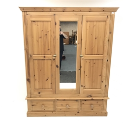 Solid pine triple wardrobe projecting cornice, two doors flanking single central mirror panel above three drawers, plinth base, W157cm, H196cm, D58cm
