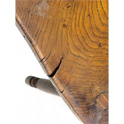 Early-to-mid 19th century elm and ash high-back Windsor armchair, central vase-shaped splat flanked by slender vertical spindles, outward-curving arms, shaped and dished saddle seat, raised on turned and splayed supports united by H-stretcher