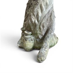 Two weathered cast stone garden hares