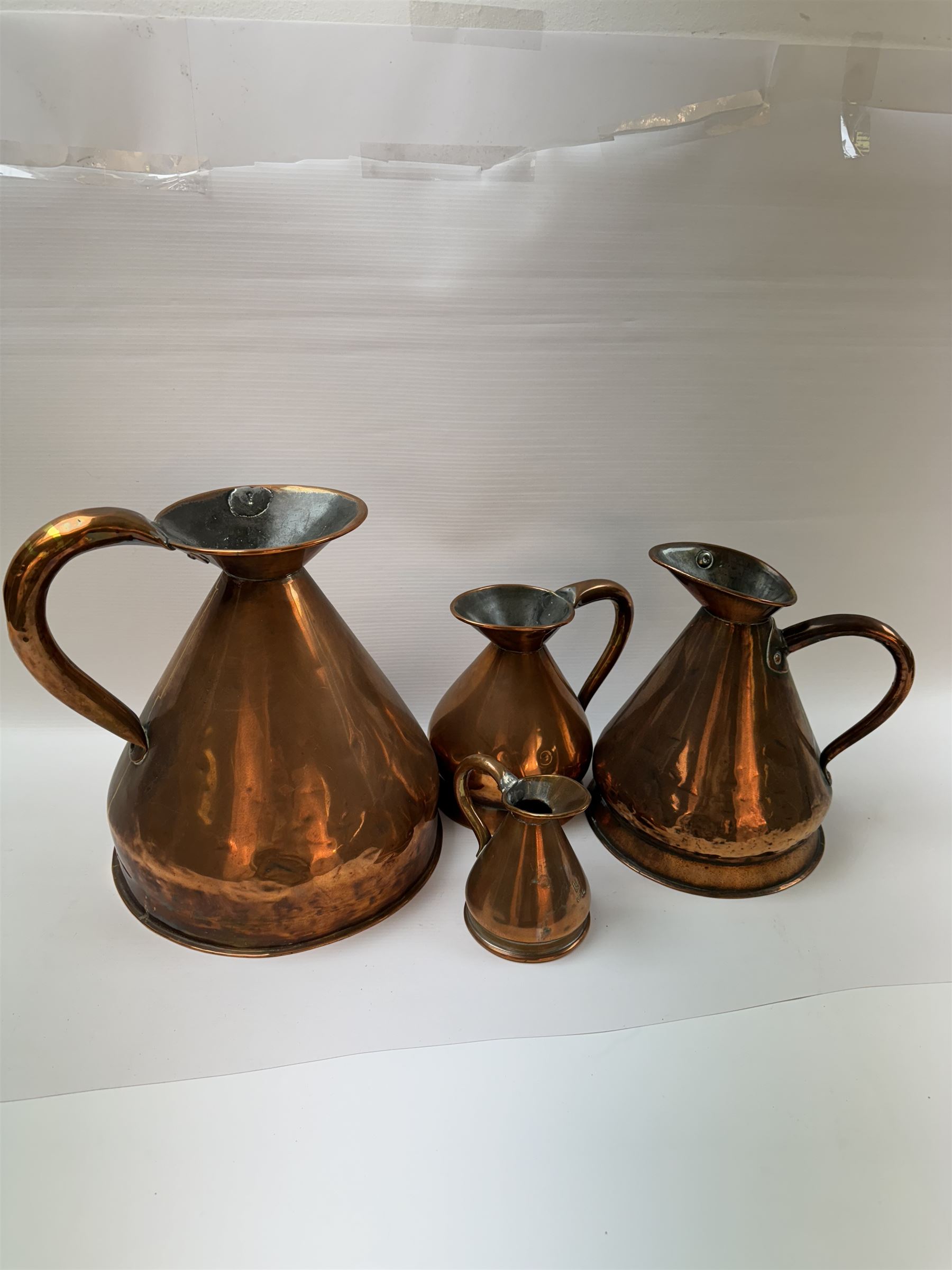 Graduated set of four copper haystack measures, by Corrie & Son Perth