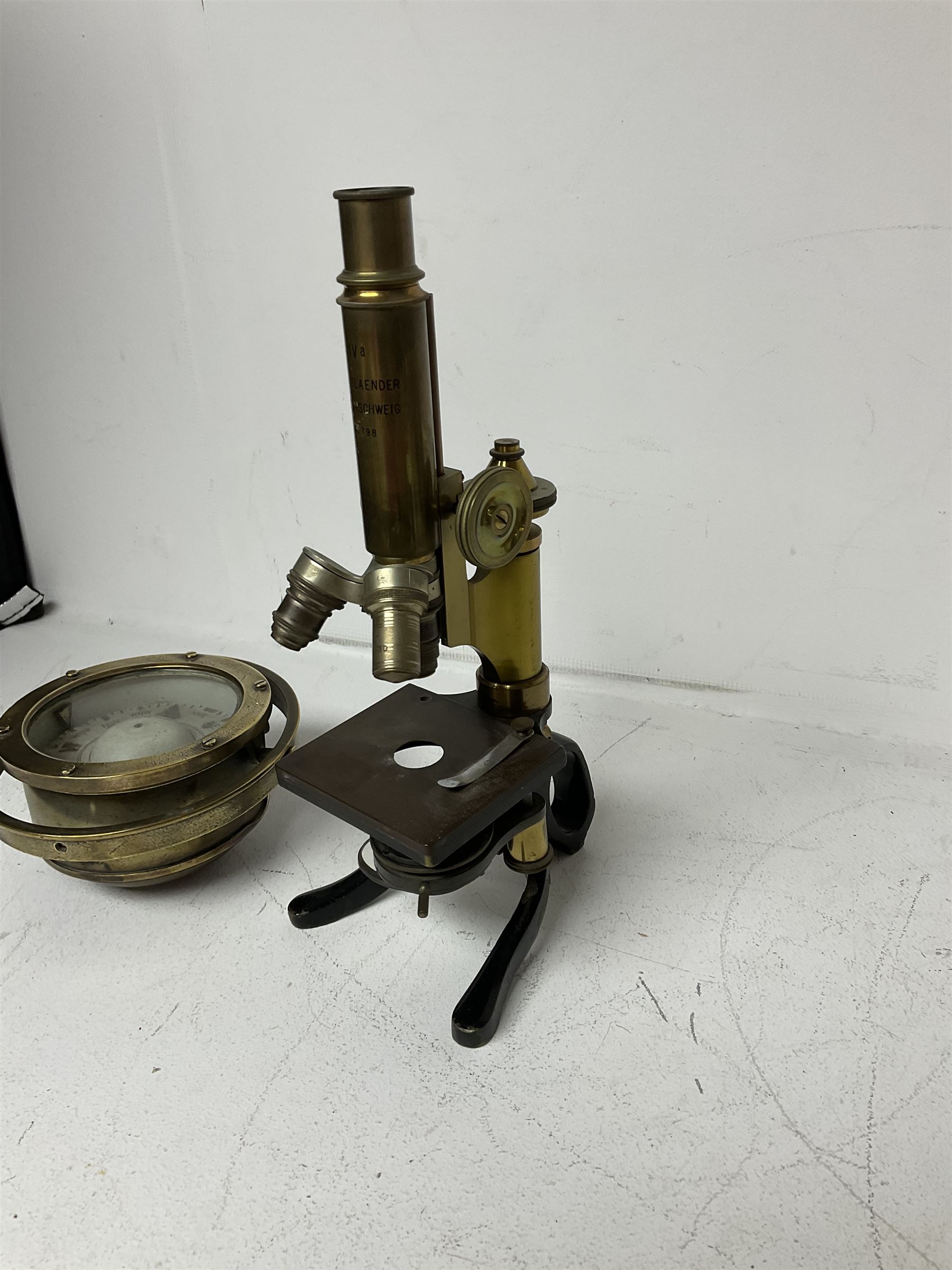 Early 20th century lacquered brass microscope stamped 'VOIGTLAENDER BRAUNSCHWEIG no 798' and Sestrel brass cased compass