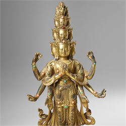 Tibetan gilt bronze figure of Ekadashamukha Avalokiteshvara, standing upright on lotus base, his primary hands in anjali mudra, the other six radiating to the sides, H28cm; together with a gilt bronze figure of Ganesh or Ganapati, H26cm (2)