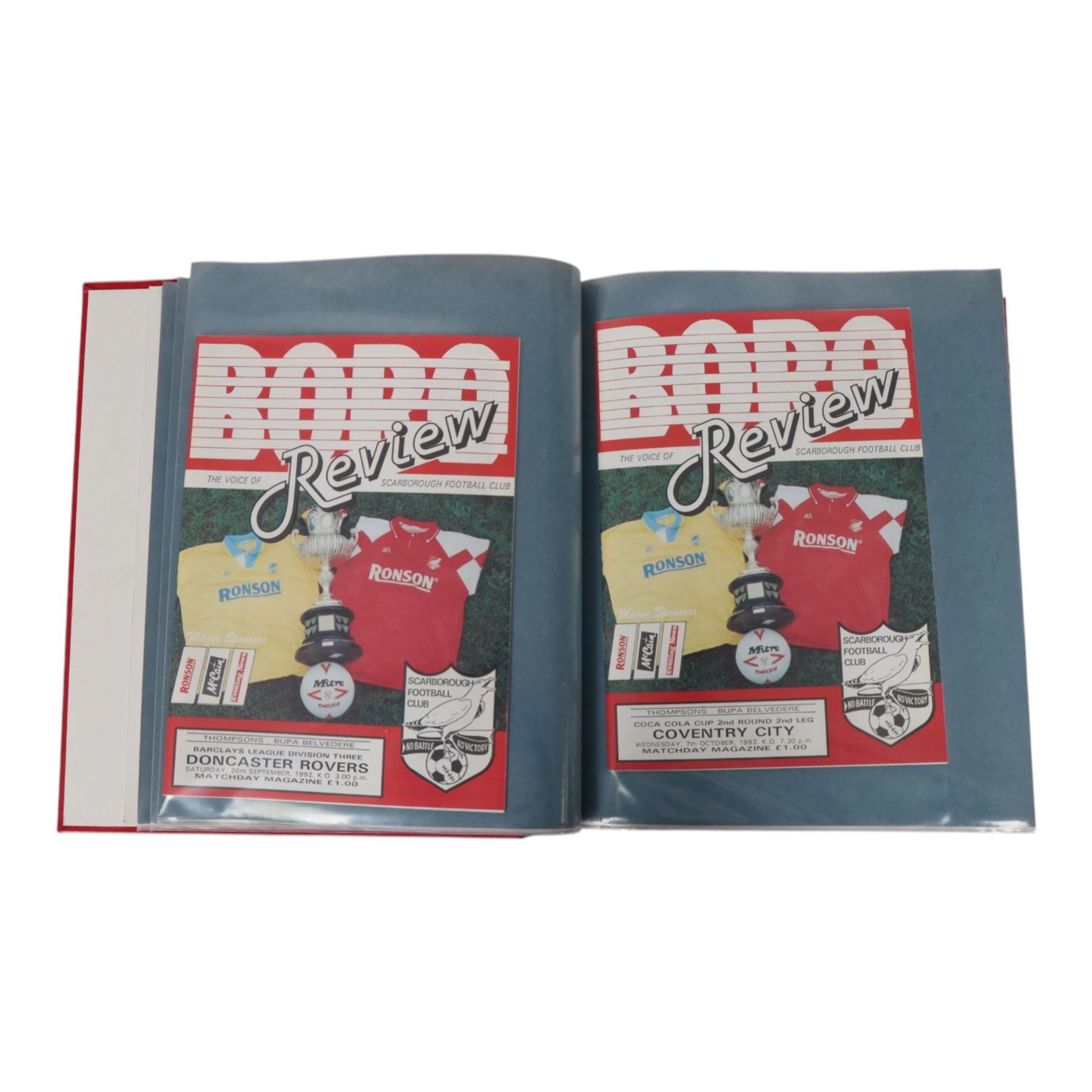 Comprehensive collection of approximately one hundred and seventy Scarborough FC football programmes for the 1990/91, 1991/92 and 1992/93  seasons, all filed within six dedicated Scarborough FC red Home and Away binders
