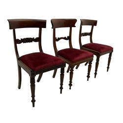 Seven early 19th century mahogany dining chairs - set six side chairs with scroll carved middle rails (W46cm), and a carver elbow chair with rope twist middle rail