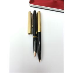 A Montblanc 227 fountain pen and 287 ballpoint pen set, circa 1970, each with black resin body, reeded gold plated cap, and white star emblem detail, the fountain pen with piston filling mechanism and nib marked 585, the ballpoint with lever action, in maker's case. 