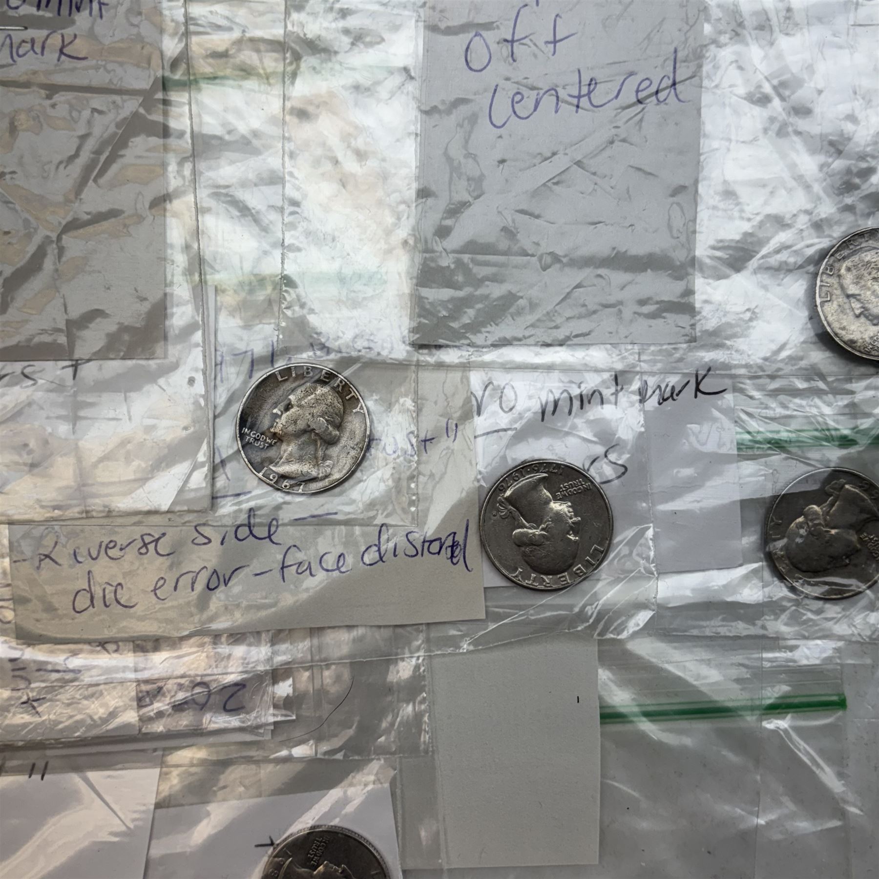 Collection of United States of America coins, 1965 onwards, principally quarter dollars, many with alleged minting errors as annotated on labels