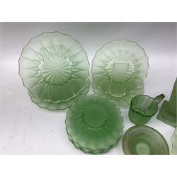 Collection of uranium, carnival and green glass, to include vase upon a stepped base, set of plates in various sizes, milk jug etc