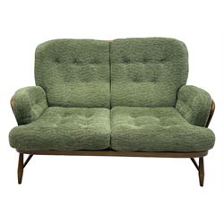 Ercol - mid-20th century three-piece suite, comprising two-seater sofa, upholstered in green fabric with teak frame, on splayed supports with stretcher (W142cm, D95cm, H87cm); with matching pair of armchairs (W82cm, D95cm, H87cm)