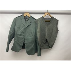 WW2 British female ATS Sergeant's service uniform grouping, consisting of four pocket female pattern service dress tunic with brass ATS shoulder titles and general service buttons; cloth lined interior with the original printed size label dated 1942; the matching khaki service dress skirt; and Greatcoat with size label dated 1945; together with army knitted sleeveless V-neck jumper; WRAC tunic, skirt and overcoat; full length cream and gold thread military evening dress by Hilliers Couture; and four webbing belts