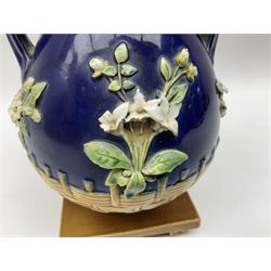 Minton majolica vase, the squat body with twin handles, with part osier moulding and applied Spring flowers against a cobalt blue ground, upon integral square base, impressed beneath Minton 1316, H16.5cm