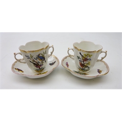  Pair late 19th century German Helena Wolfsohn quatrefoil chocolate cups and saucers, hand painted with birds perched on branches amongst insects within a floral gilt border (4)  