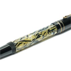 Montblanc Meisterstück Oscar Wilde limited edition fountain pen, black resin cap and barrel with marbled ivory and black patterned lower barrel and gold-plated fittings, the cap signed with Oscar Wilde facsimile and surmounted by the white star emblem, fitted with a medium 18K (750) gold nib engraved 4810, 1994 and MONTBLANC, model no. 28616, presented in original lined fitted case in the form of a book with outer box