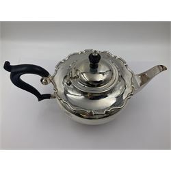 1920s five-piece silver tea service, comprising teapot, coffee pot, hot water pot, twin handled open sucrier and milk jug, each of squat circular form with shaped rim, the teapot, coffee pot and hot water pot each with ebonised handle and finial, the sucrier and milk jug with acanthus capped scroll handles, all upon circular foot, hallmarked R F Mosley & Co, Sheffield 1926 & 1927, tallest H24cm
