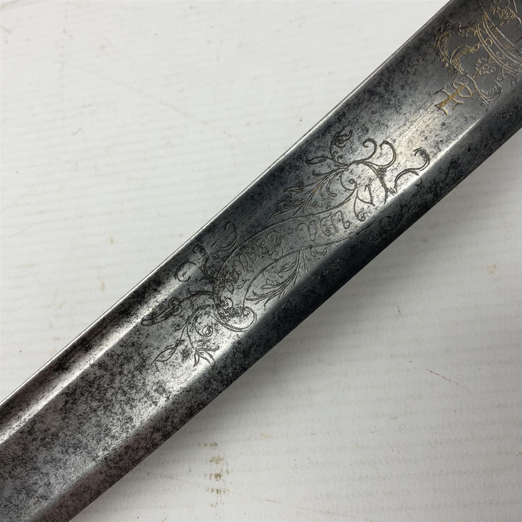 Late 18th century sword, the Spanish 79.5cm curving fullered blade engraved with the Royal Cypher, battle trophies and 'Viva Espania' banner, French Sabre de Mineur brass three-bar hilt with ebonised reeded grip L93.5cm overall (no scabbard)