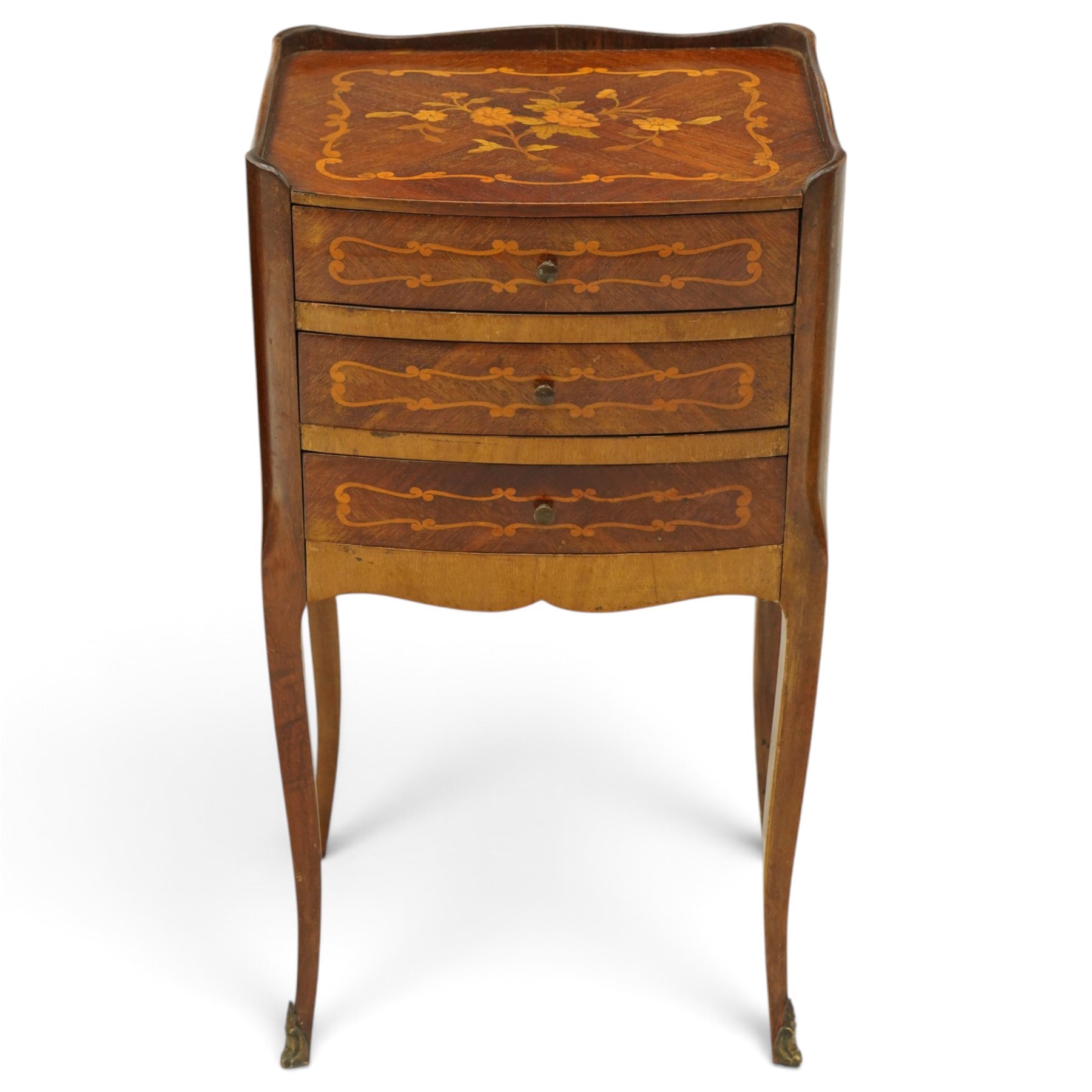 Matched pair of French inlaid floral marquetry bedsides, the three-quarter gallery tray top with central floral bouquet inlay and C-scroll border, one fitted with single frieze drawer over recessed cupboard and shaped apron, the other with three drawers, raised on tapering cabriole supports, with brass cartouche feet