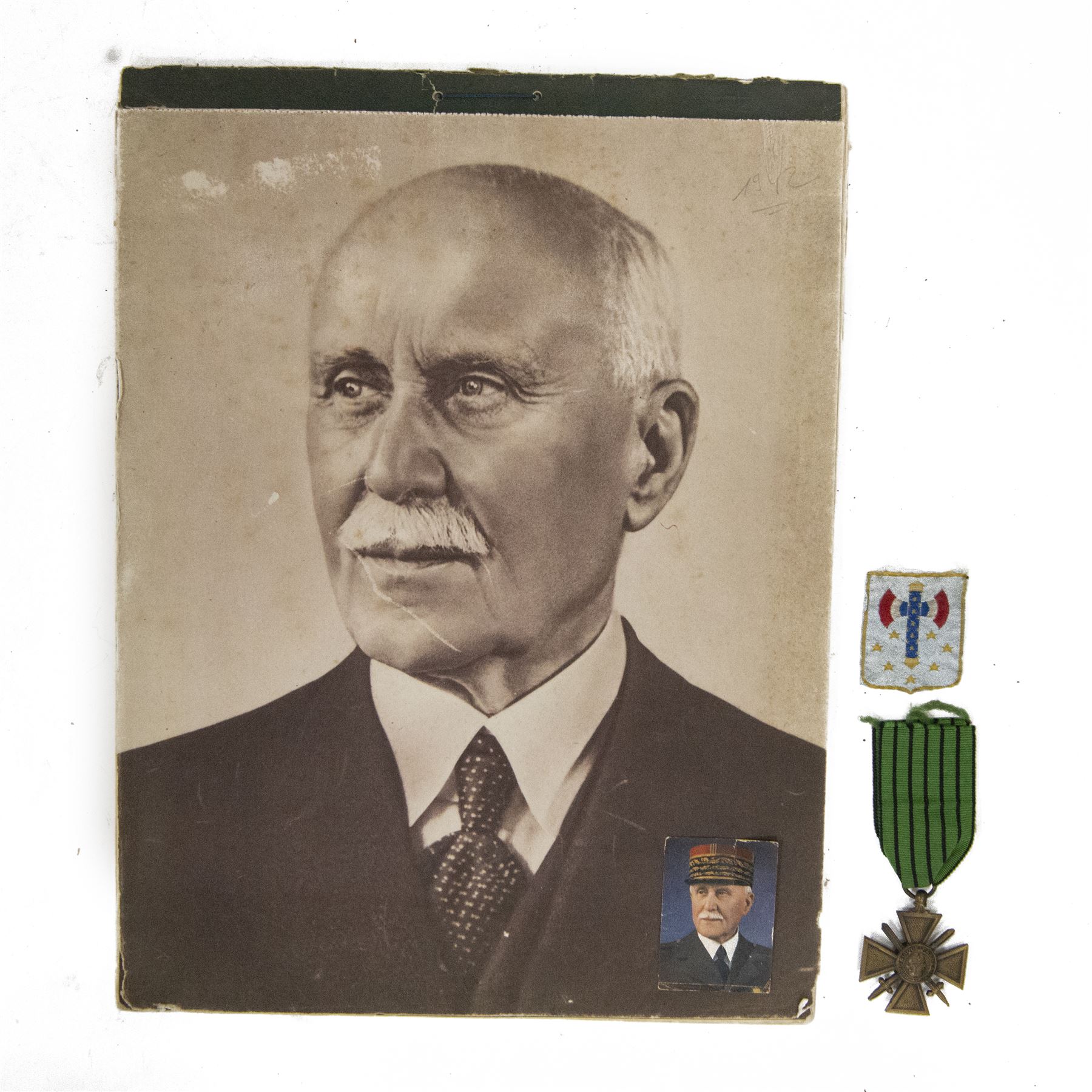 French Vichy uniform cloth insignia, together with Vichy Croix de Guerre 1939-1940, small school handout card of Marechal Petain and Vichy Petain calendar