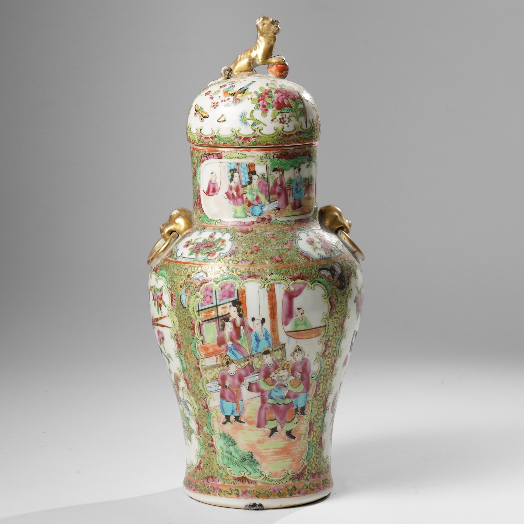 Cantonese famille rose vases, of inverted baluster form, the domed cover with gilt dog of Fu finial, H38cm; together with a further pair of Cantonese vases, each with double Buddhist lion handles and applied at the shoulders with chilong, H45cm (3)