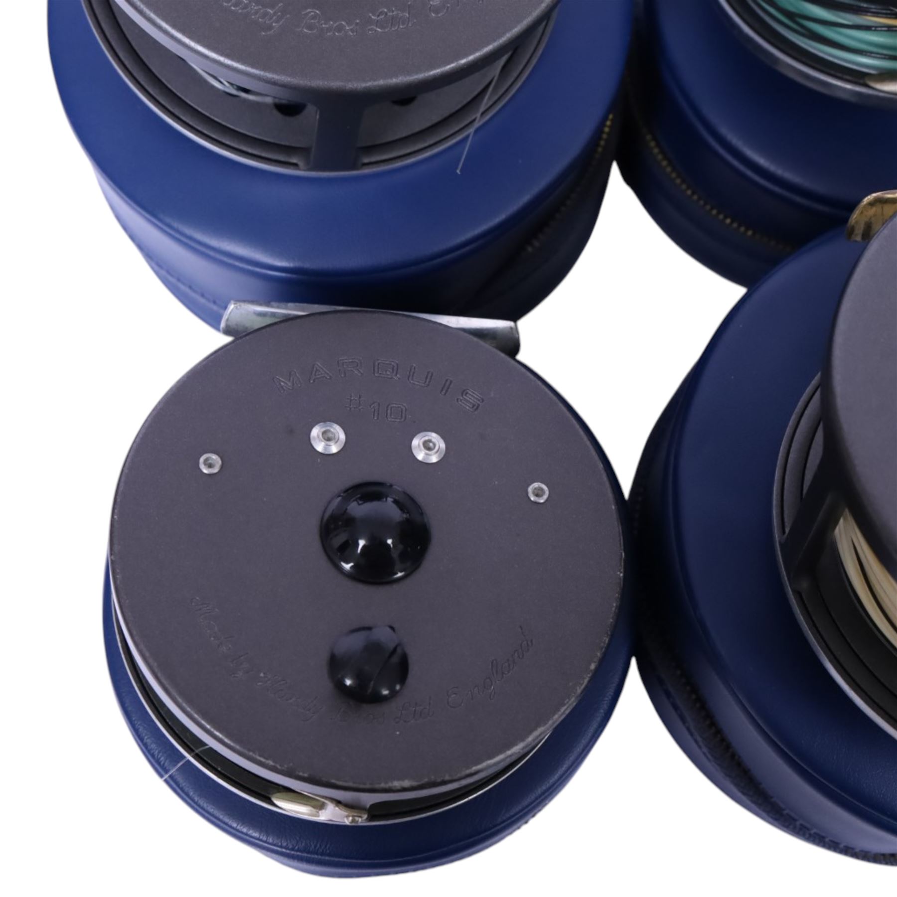 Four Hardy Bros Marquis fly fishing reels, comprising two No. 3 salmon reels, No.1 Salmon reel and a No. 10 reel, all within blue Hardy cases