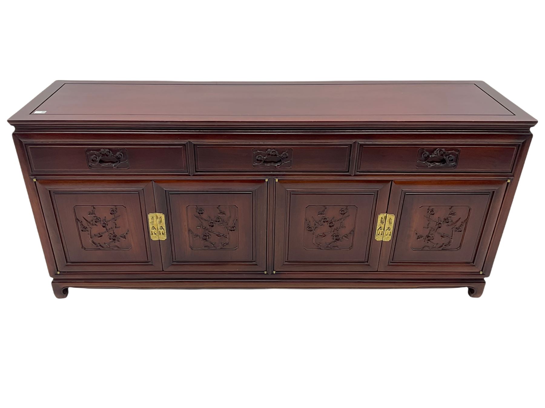 Chinese hardwood sideboard, three drawers above four cupboards, the doors relief carved with flowers and birds 