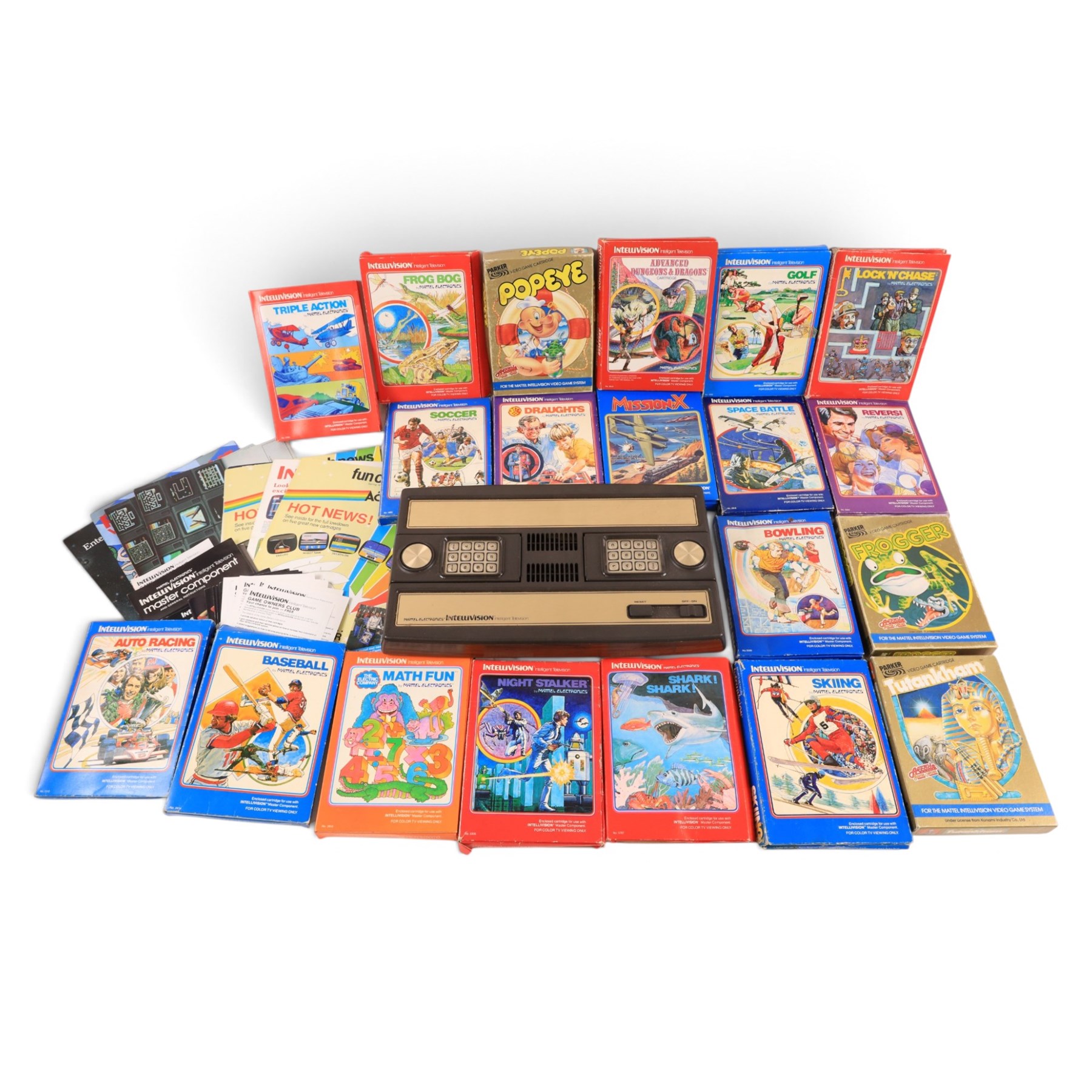 Mattel Electronics Intellivision Intelligent Television Master Component and twenty boxed games comprising Golf, Soccer, Lock N Chase, Reversi, Night Stalker, Math Fun, Baseball, Shark! Shark!, Skiing, Tutankham, Frogger, Popeye, Advanced Dungeons & Dragons, Draughts, Triple Action, Frog Bog, Mission-X, Space Battle, Bowling and Auto Racing 