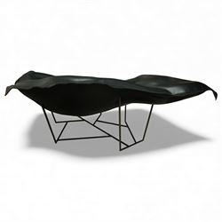 Poliform - ‘Wallace’ armchair, sculptural leaf-form silhouette upholstered in black leather, raised on triangular metal supports