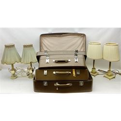 Set of three graduating Antler suitcases, together with four onyx and metal table lamps with pleated fabric shades