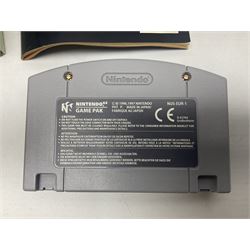 Nintendo 64 console, two controllers, games and accessories. Accessories to include the ‘Tremorpak’ and ‘Spook’ 2 Phono plugs and a S-VHS plug with adapter, both in original boxes. Games to include ‘Golden Eye 007’, ‘Doom 64’, ‘Killer Instinct Gold’, ‘Tetrisphere’, ‘F-1 World Grand Prix’, ‘Pilotwings 64’ and ‘Lylatwars’ with ‘Rumble Pak’, all with original boxes and instruction manuals. ‘Star Wars Episode I Racer’ game cartridge in Shadows of the Empire box. 