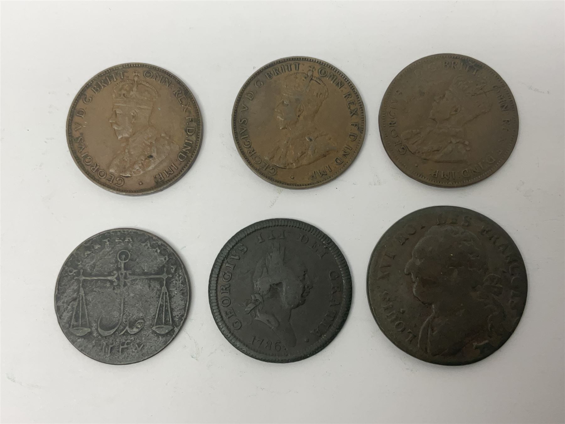 Thirty six late 18th century and onwards United Kingdom and World coins and tokens, to include 1772 Catherine II 5 Kopecks, Swedish quarter and half Skilling pieces dated 1809 and 1806, two Skilling Courant piece dated 1810, 1831 Isle of Man half penny token etc 