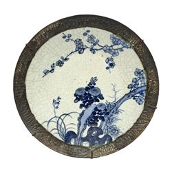 20th century Chinese blue and white crackle glaze charger, decorated with peonies, prunus blossom, and rockwork, within simulated bronze border, with character mark verso, D34cm