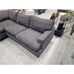 Large corner sofa upholstered in grey fabric 