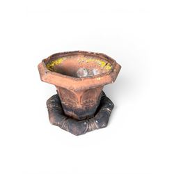 Small 19th century terracotta octagonal planter with stand, flower and leaf design