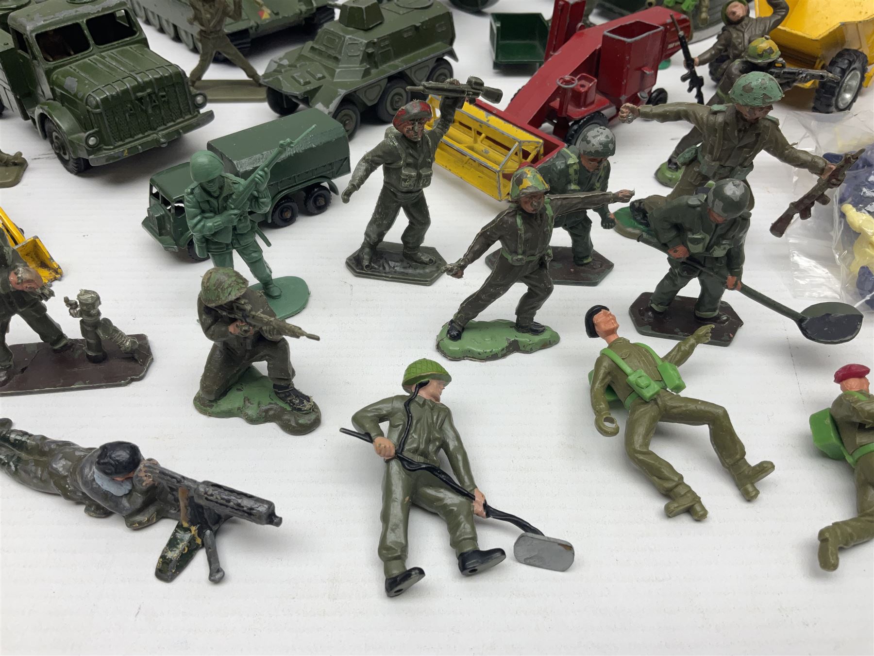 Various makers - unboxed and playworn die-cast models including Dinky Thornycroft Mighty Antar Tank Transporter No.660 and Centurion Tank No.651, other military and farm vehicles; and quantity of loose plastic soldiers and other figures by Crescent, Britains etc